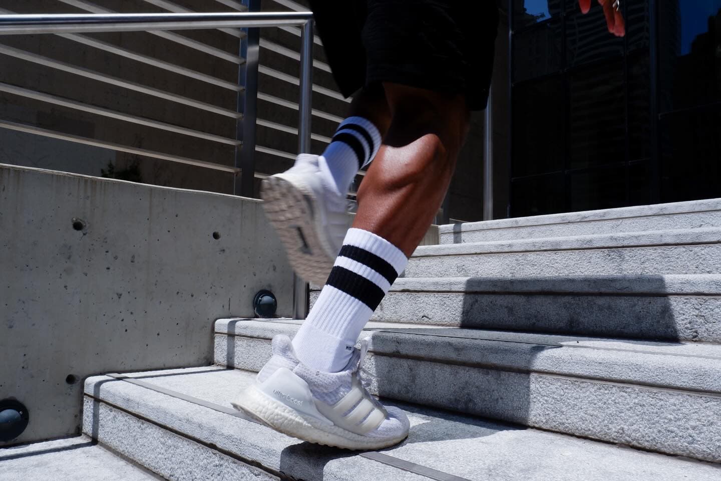 PYVOT crew socks worn in motion on concrete steps; example style