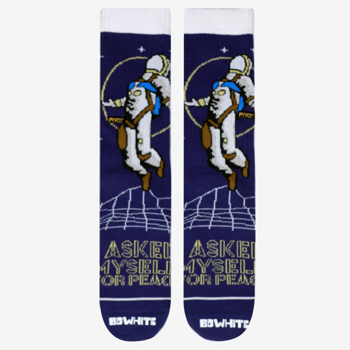 Space man socks  laying flat shows astronaut floating through deep space. Space sock made with premium combed cotton , compression, and arch support. Blue space socks with white highlights and yellow lining. Perfect for all matters space and time..